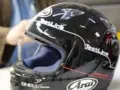 Casco da moto nero lucido con logo "TestLine" e certificazione Snell E1.